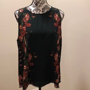 Cute floral top. Cut out back.